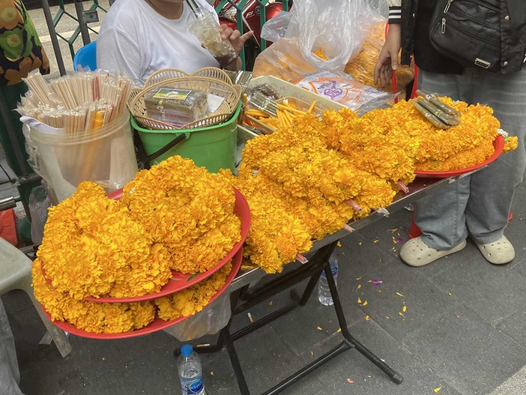 You can always buy flower garland at the front of the shrine and offer to Bhrama after finish praying
