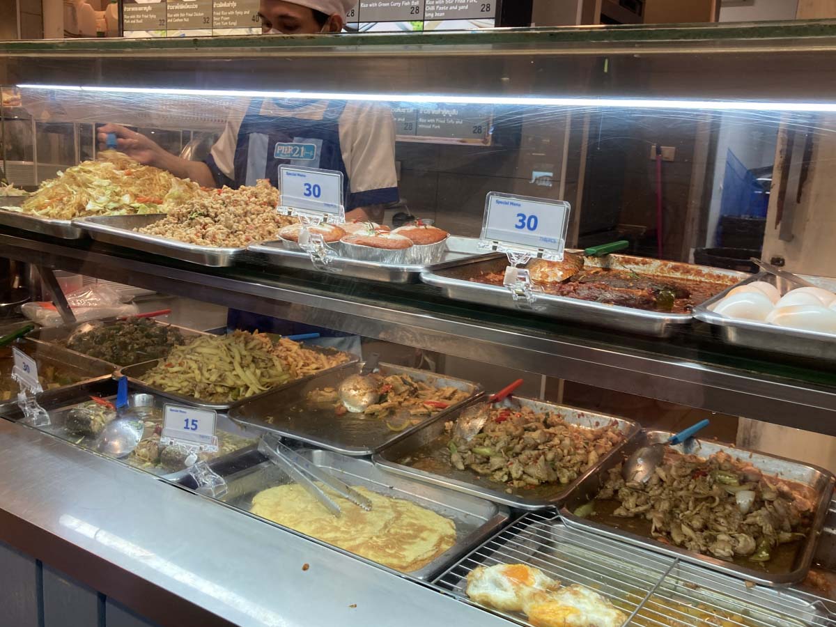 Local food at food court. Pick 2-3 kinds and eat with rice. Be careful, it can be very spicy.